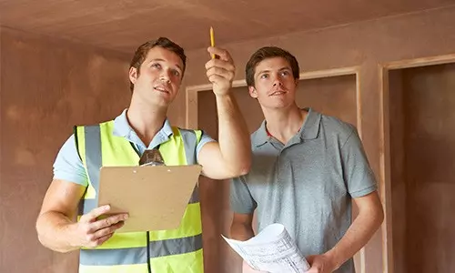 surveyor inspecting a house